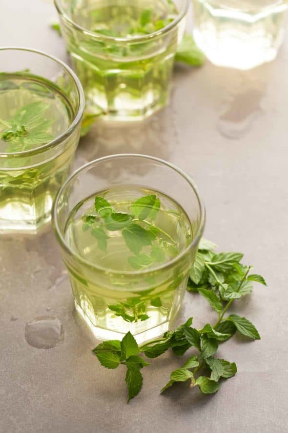Fresh mint tea in glasses with mint sprigs