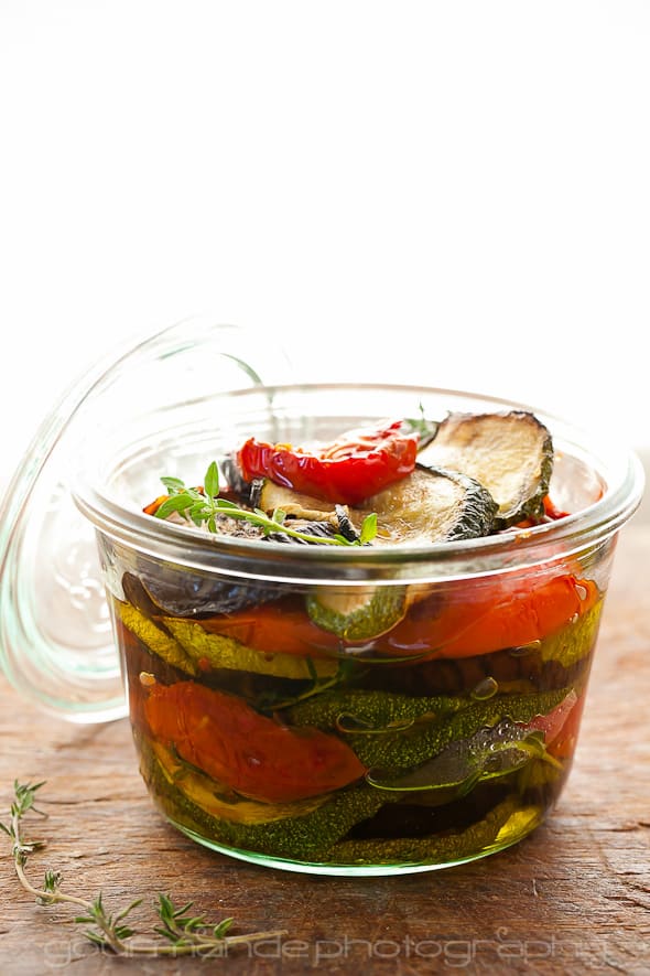 eggplant, zucchini and tomatoes in glass jar