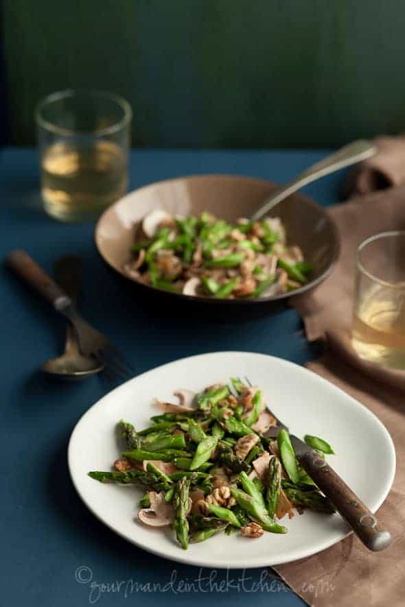 Raw Asparagus and Mushroom Salad with Miso Dressing on Plates with Wine