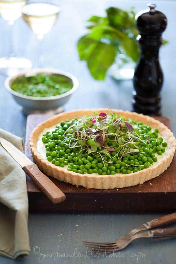 Gluten-Free Pea and Herbed Goat Cheese Tart on Wood Board