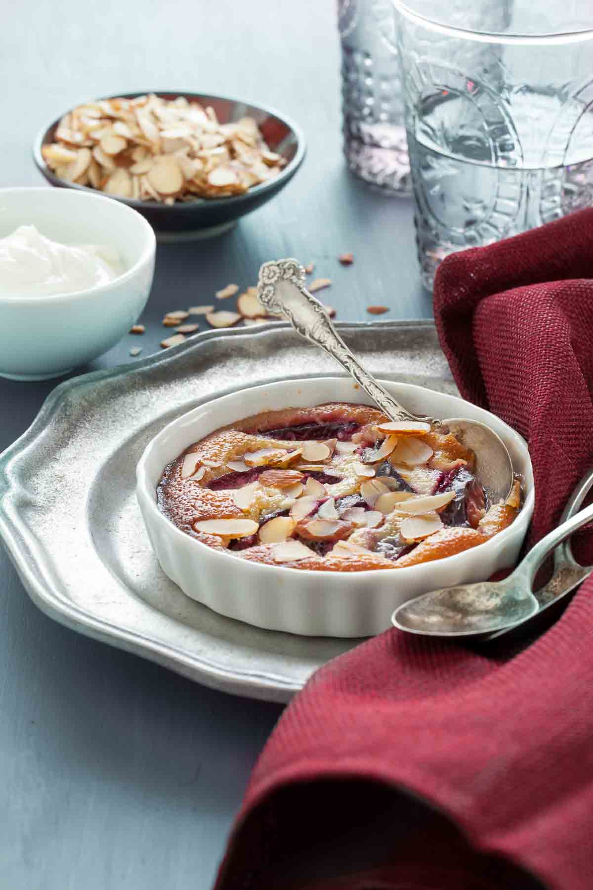 Plum Frangipane in individual tart dish with spoon