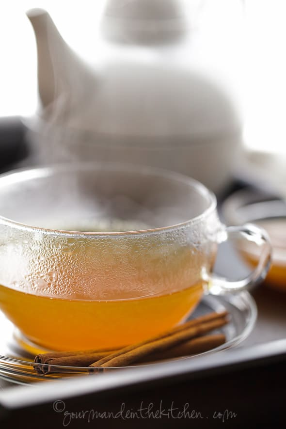 Spiced Persimmon, Ginger, Cinnamon, Turmeric Tea in Glass Mug on Tray