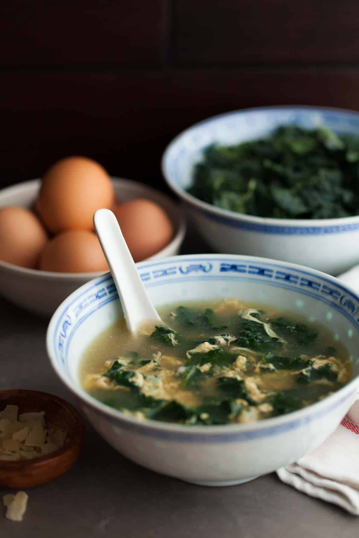 Italian Egg Drop Soup (Stracciatella) in Bowl with Spoon