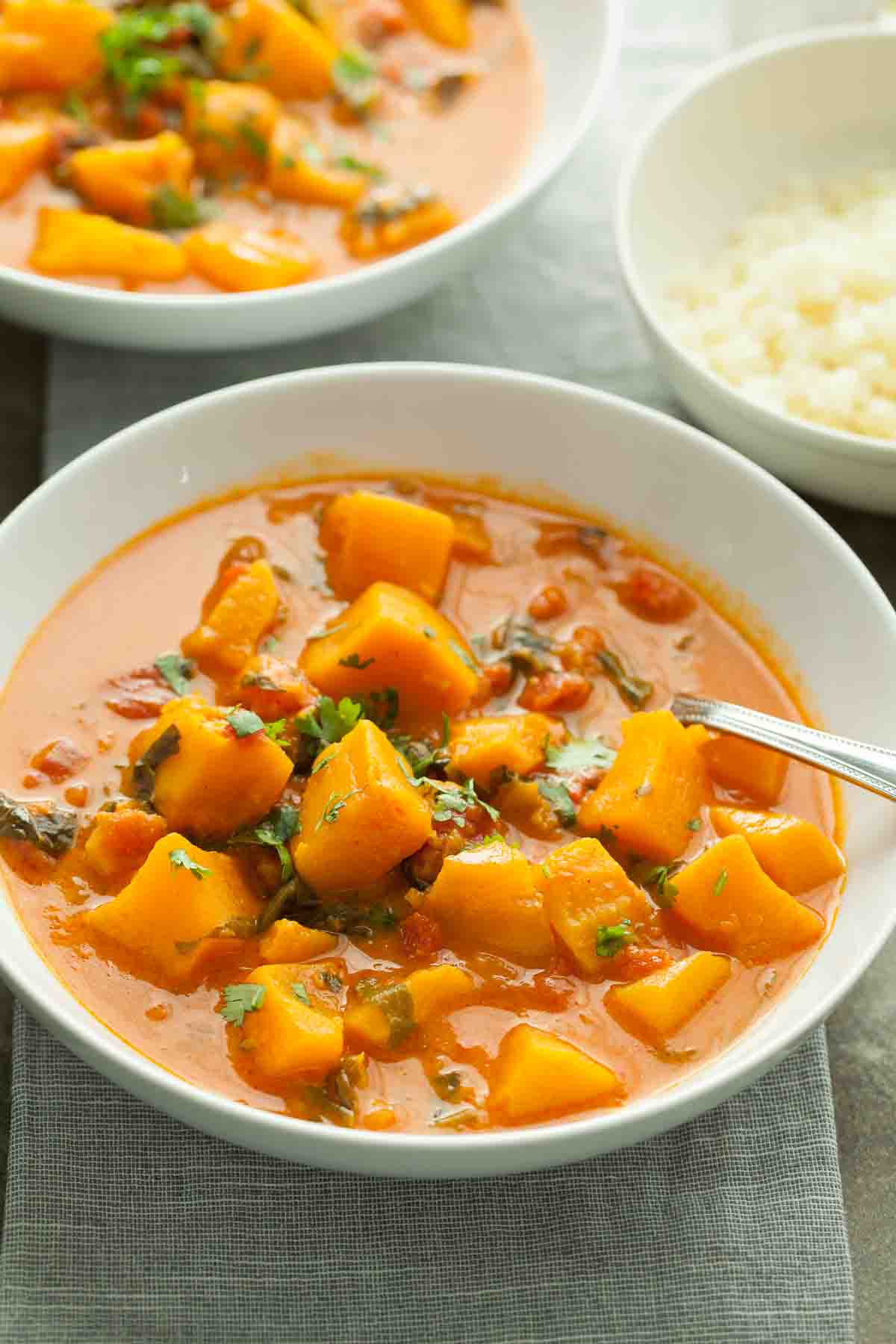 Butternut Squash Curry with Coconut Milk in Bowl with Spoon