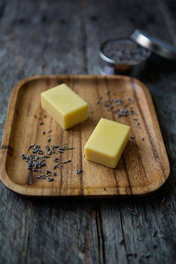 lavender lotion bars on wood tray