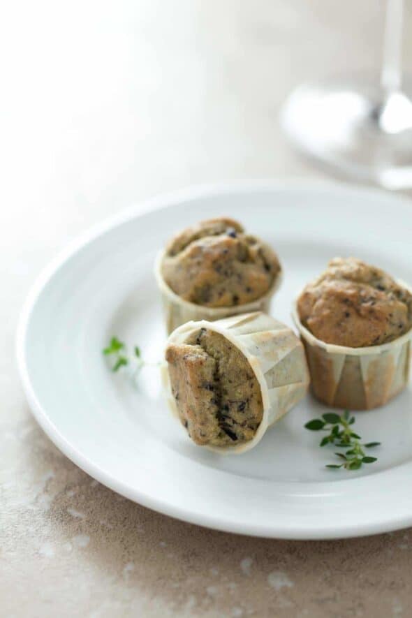 Savory grain-free miniature muffins studded with bits of chopped black olives, fresh thyme and salty feta cheese.