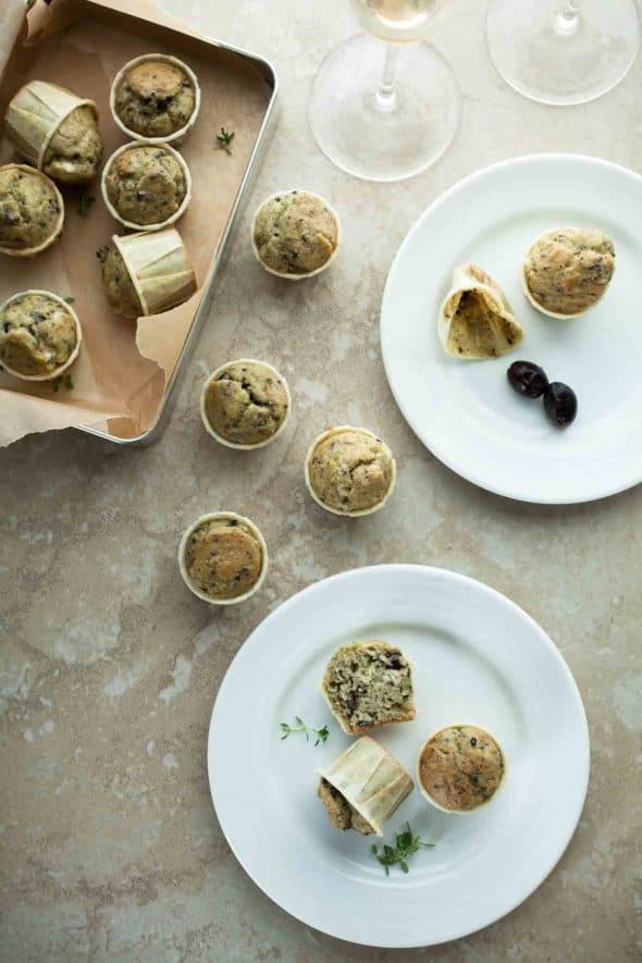 Savory grain-free miniature muffins studded with bits of chopped black olives, fresh thyme and salty feta cheese.