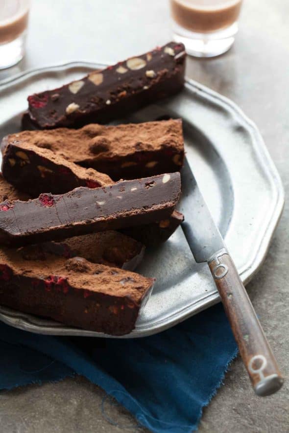 A fudgy no-bake chocolate truffle cake with raspberries and almonds that sets in the fridge and only takes minutes to make.