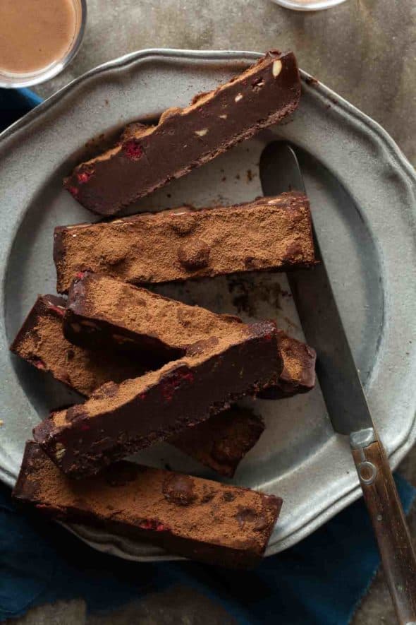 A fudgy no-bake chocolate truffle cake with raspberries and almonds that sets in the fridge and only takes minutes to make.