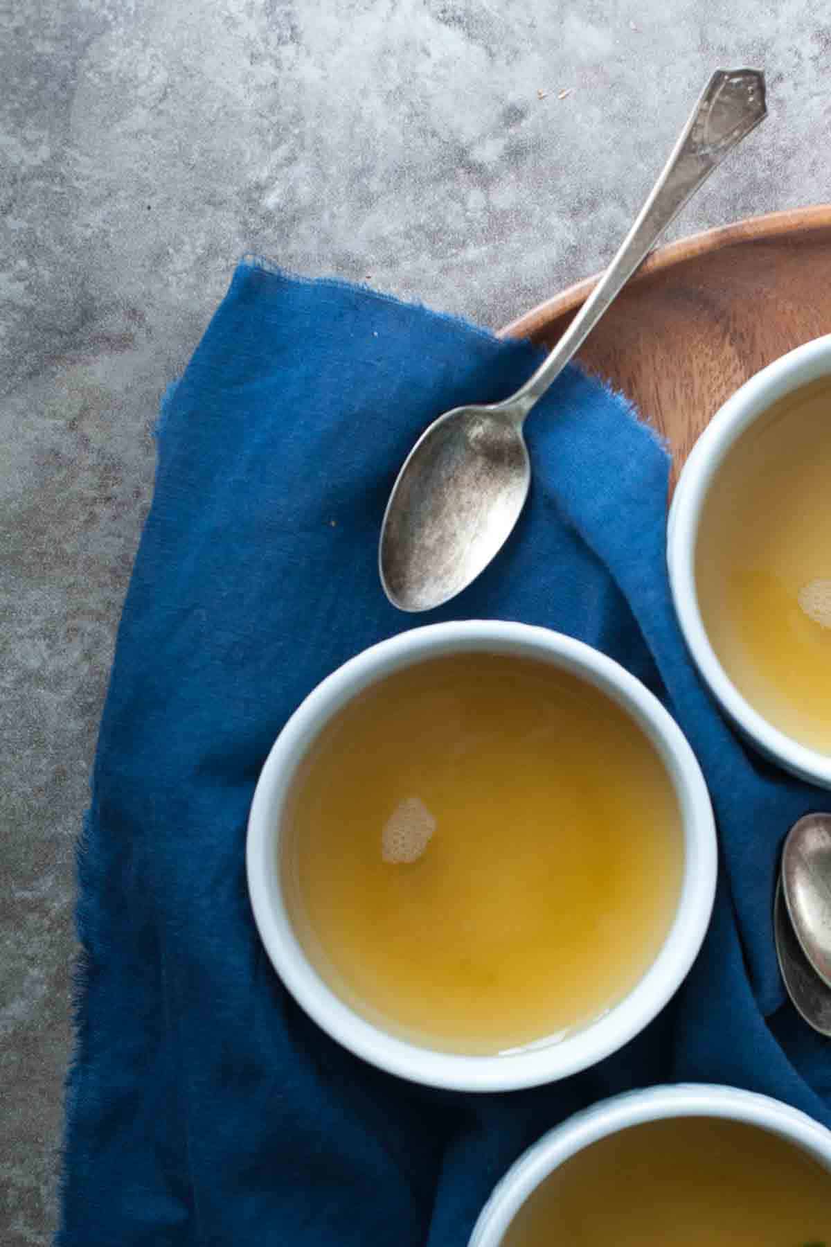 turmeric, ginger, vegetable broth in cups