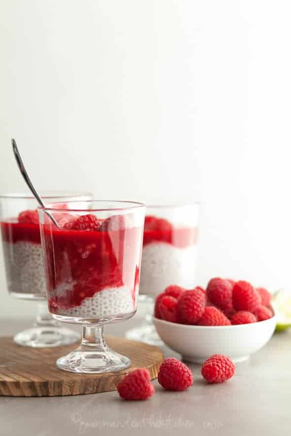 Coconut Milk Chia Seed Pudding with Raspberry Rosewater Sauce in Glasses with Bowl of Raspberries