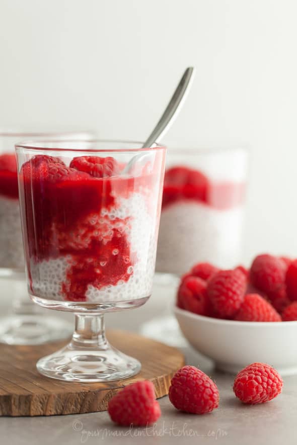 Coconut Milk Chia Seed Pudding Pots with Raspberry Rosewater Sauce in Glass with Spoon