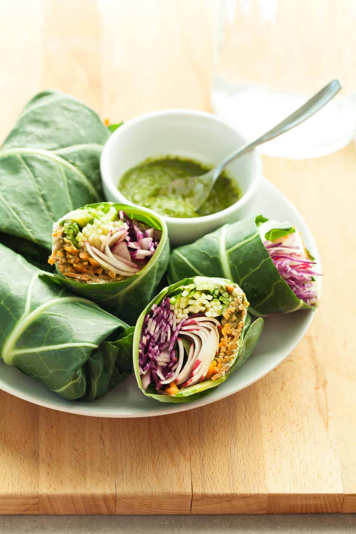 Collard Wraps on plate with sauce