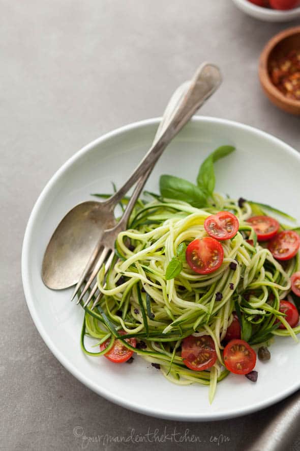 zucchini noodles, zucchini pasta, paleo noodles, vegan zucchini noodles, raw zucchini noodles, caper olive sauce, pasta puttenesca