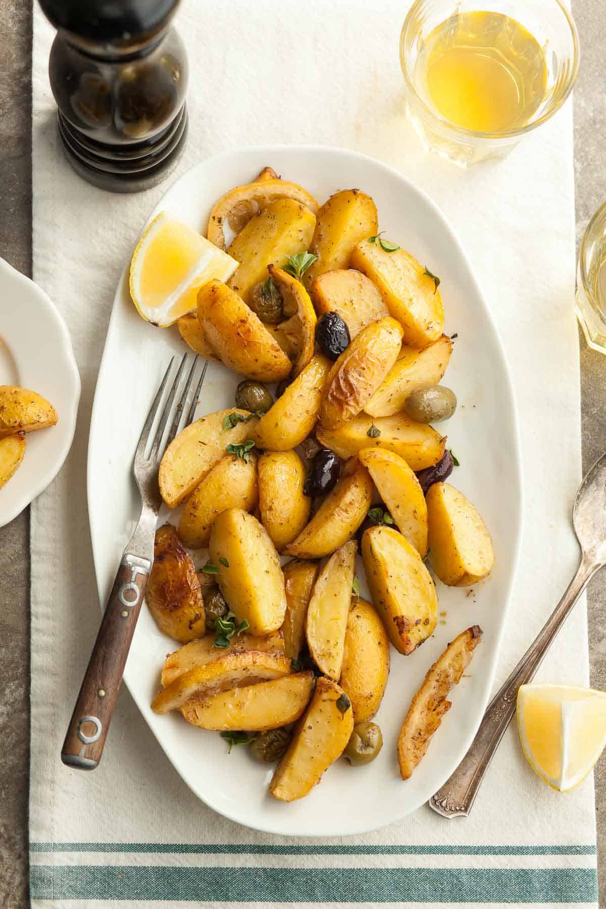 Vegan Greek Lemon Potatoes on Platter with Fork