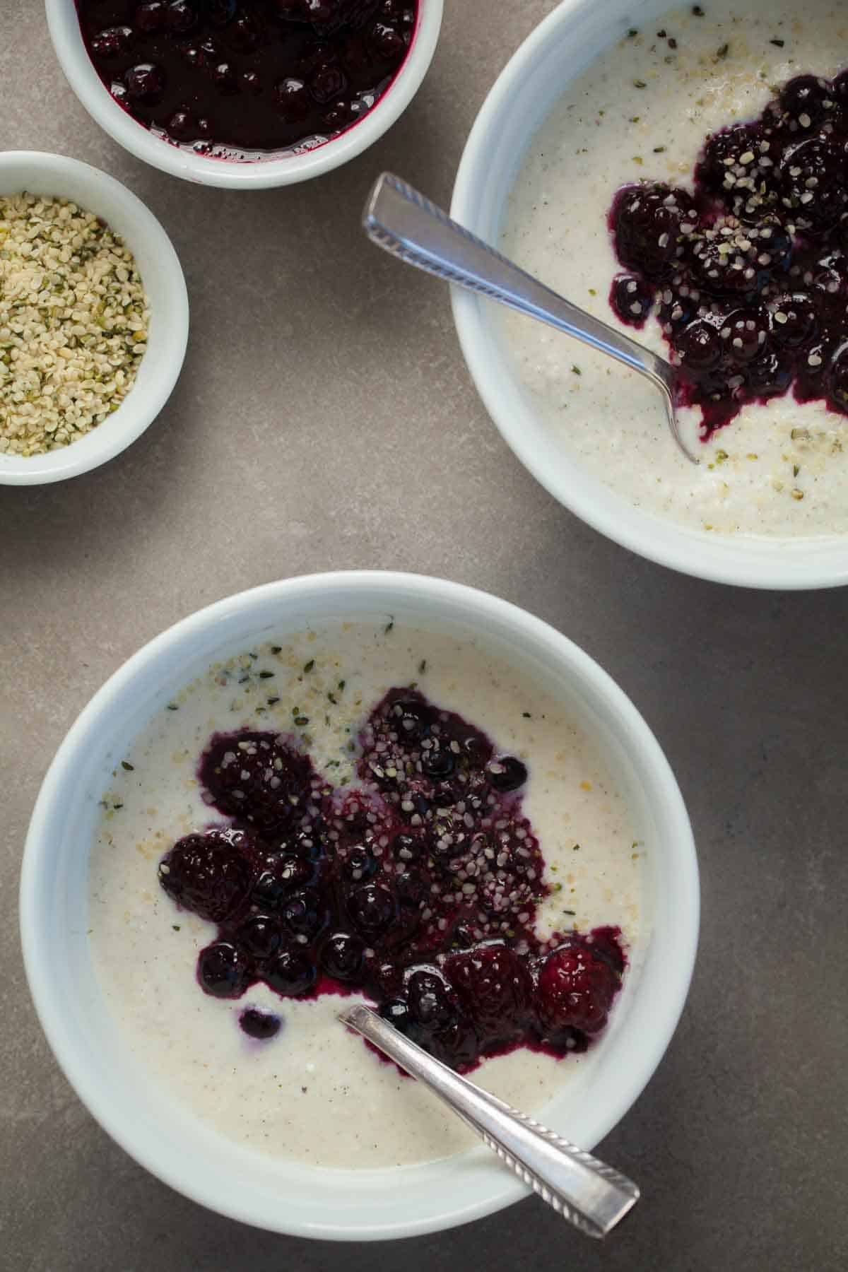 Coconut Porridge Topped with Berry Sauce in Bowls
