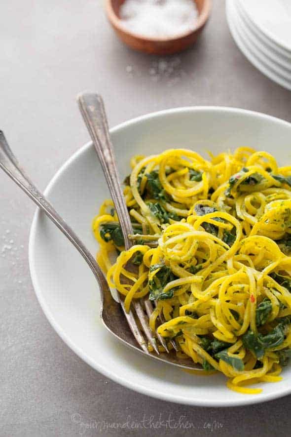 Golden Beet Noodles with Beet Greens and Cilantro Tahini Sauce in Plate