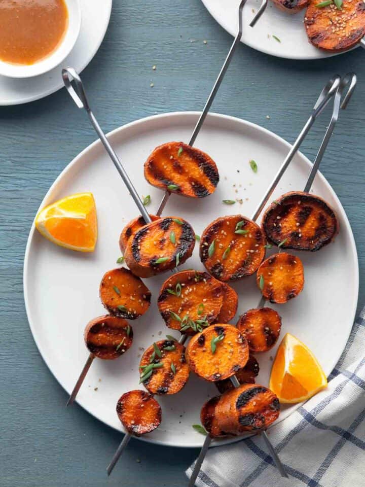 Miso-orange glazed grilled sweet potatoes cook up tender and creamy on the insides and are so much more fun than your standard baked potato on the grill.