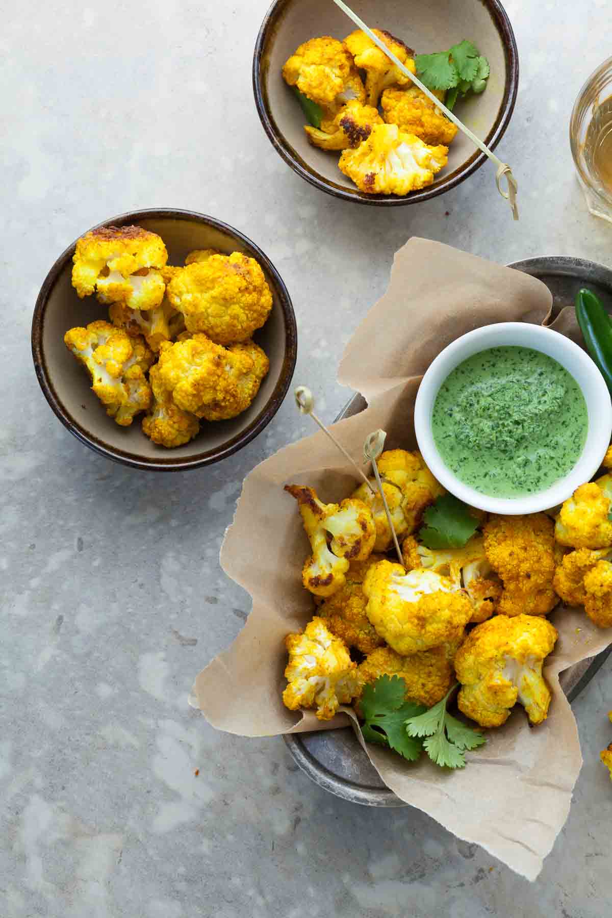 Turmeric Roasted Cauliflower Poppers  in Serving Bowls