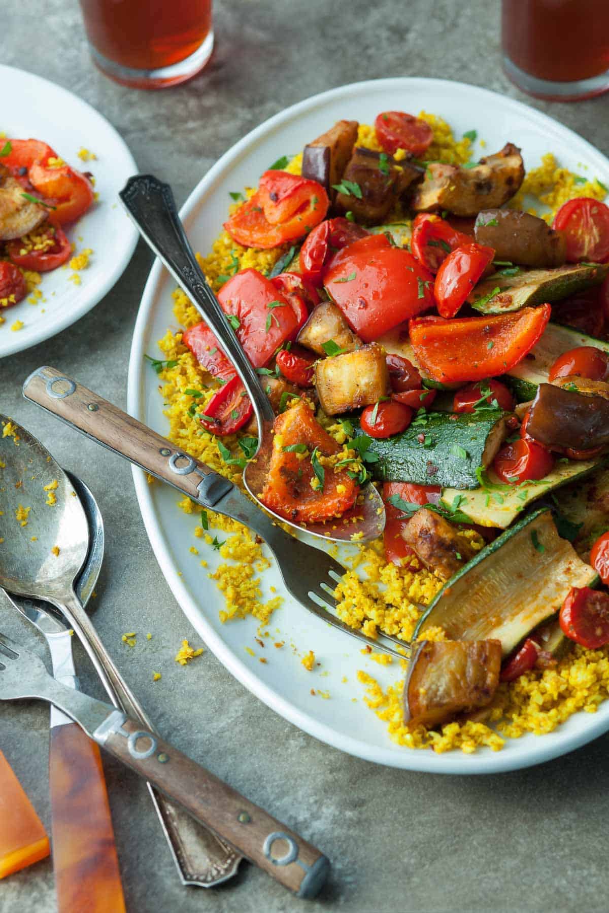 Roasted Ratatouille with Cauliflower Couscous on Plate with Spoon and Fork