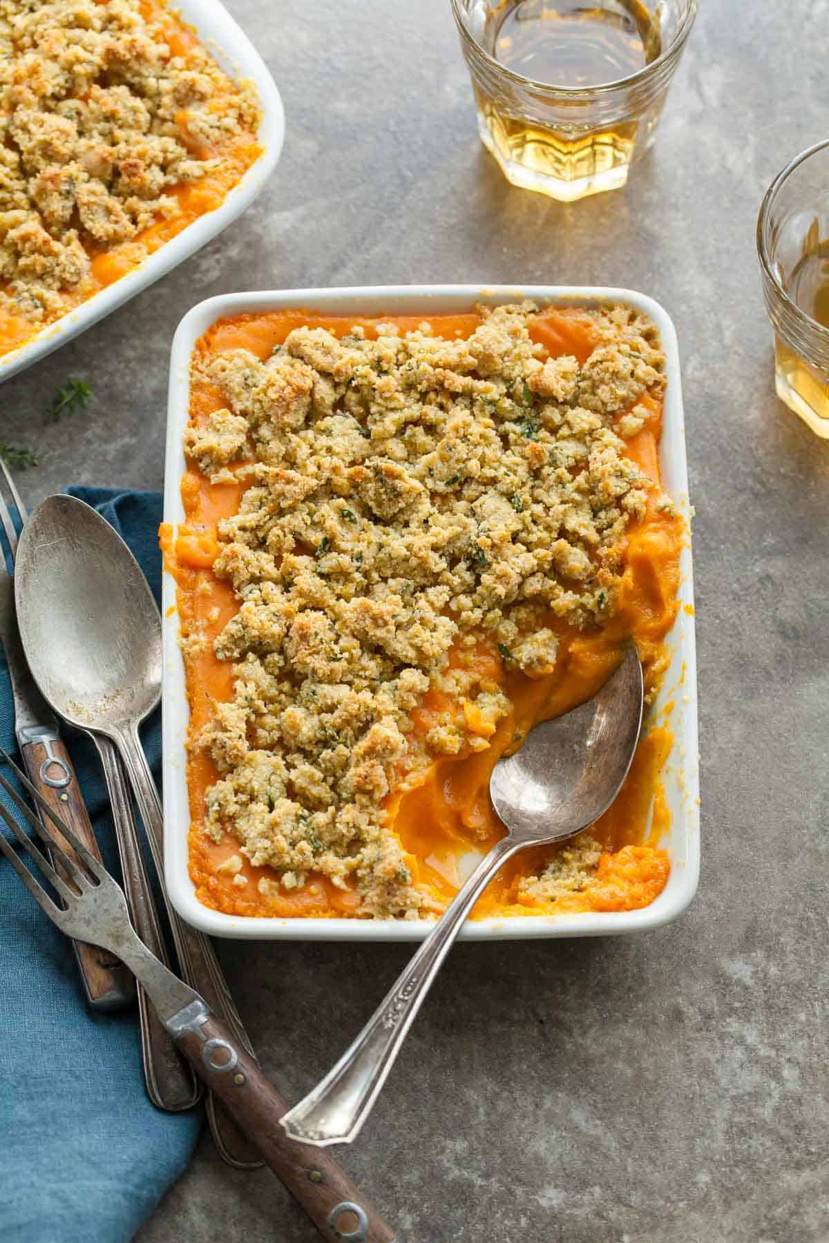 Sweet Potato Butternut Squash Gratin (Paleo, Vegan) - This thyme scented sweet potato and butternut squash gratin is a savory alternative to the usual sweet potato casserole this holiday season.