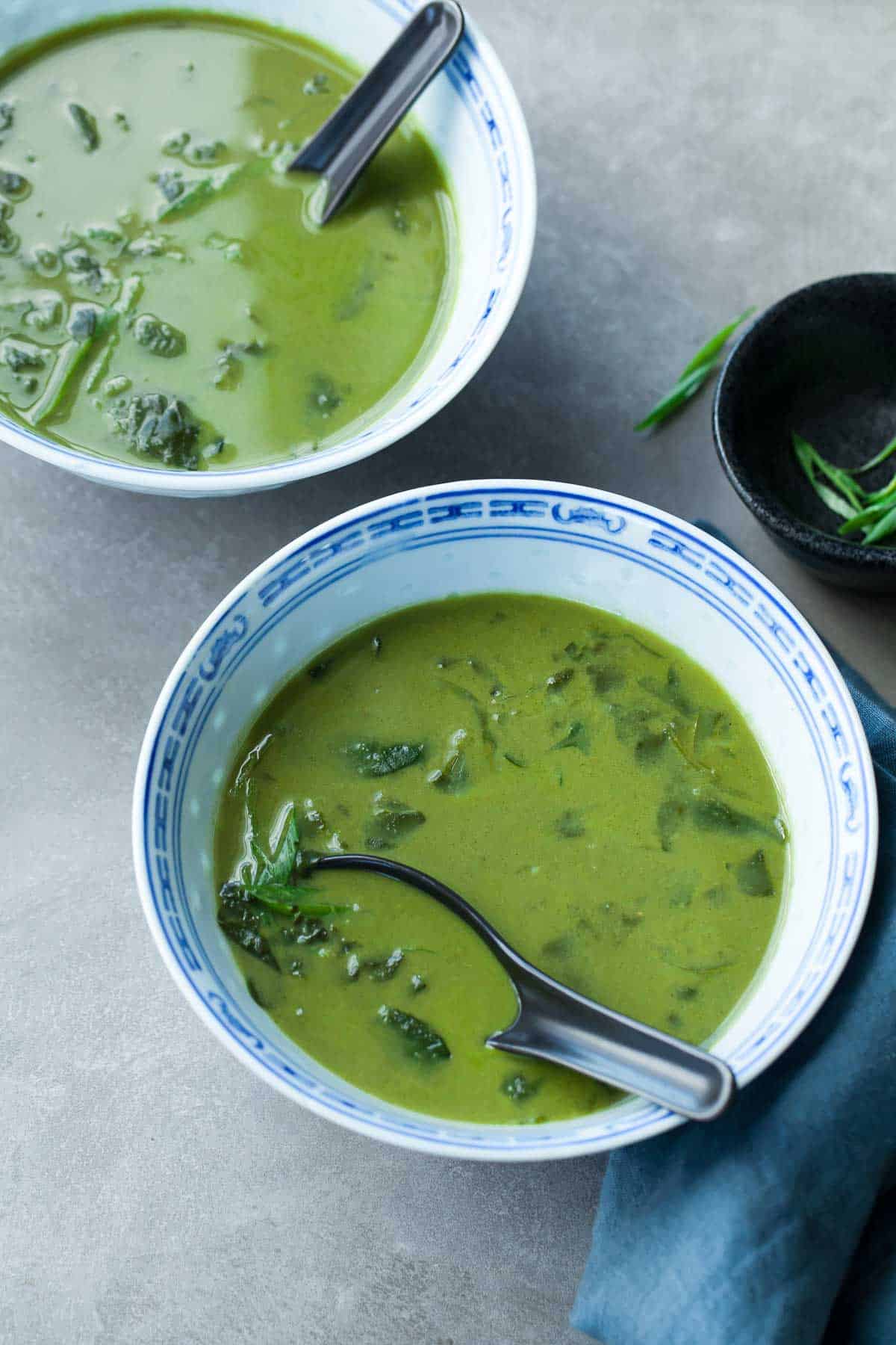 Thai Green Curry Soup in Bowls with Soups and Napkin