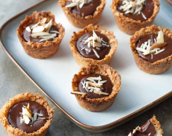Chocolate Almond Coconut Macaroon Cups (Gluten-Free) - Pretty bite-sized coconut macaroon cups with a rich chocolate almond filling.