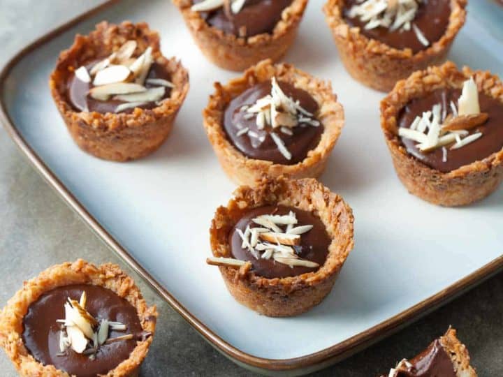 Chocolate Almond Coconut Macaroon Cups (Gluten-Free) - Pretty bite-sized coconut macaroon cups with a rich chocolate almond filling.