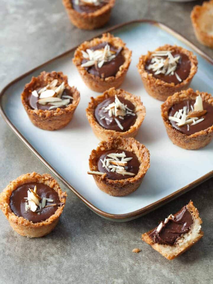 Chocolate Almond Coconut Macaroon Cups (Gluten-Free) - Pretty bite-sized coconut macaroon cups with a rich chocolate almond filling.