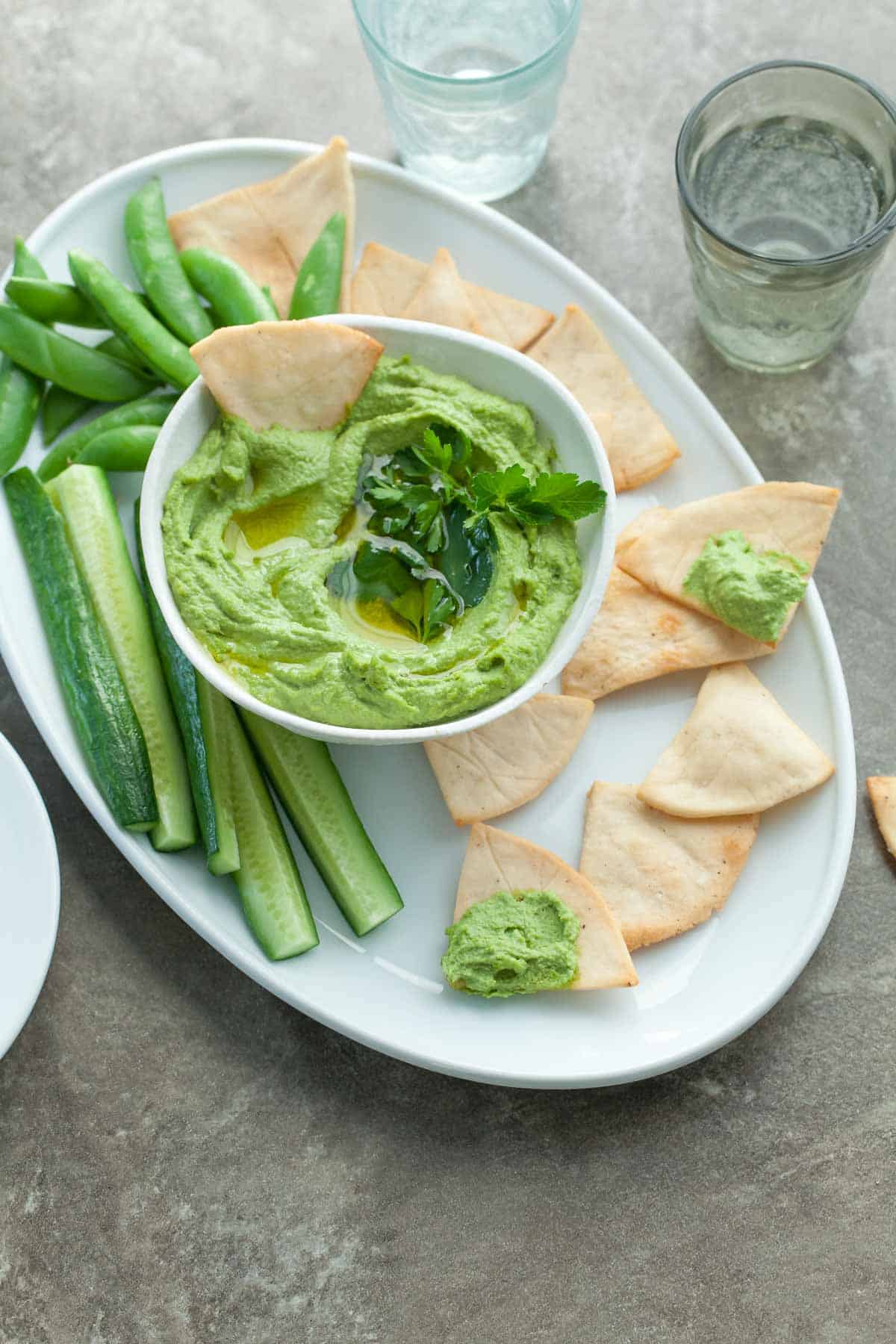 Almond Hummus in Bowl with Chips and Crudités.