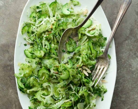 Shaved Cucumber Celery and Fennel Salad (Vegan) - A light and refreshing slaw-like cucumber, celery and fennel salad with lots of fresh herbs served on a bed of creamy almond cheese. #vegan #paleo #salad #recipe