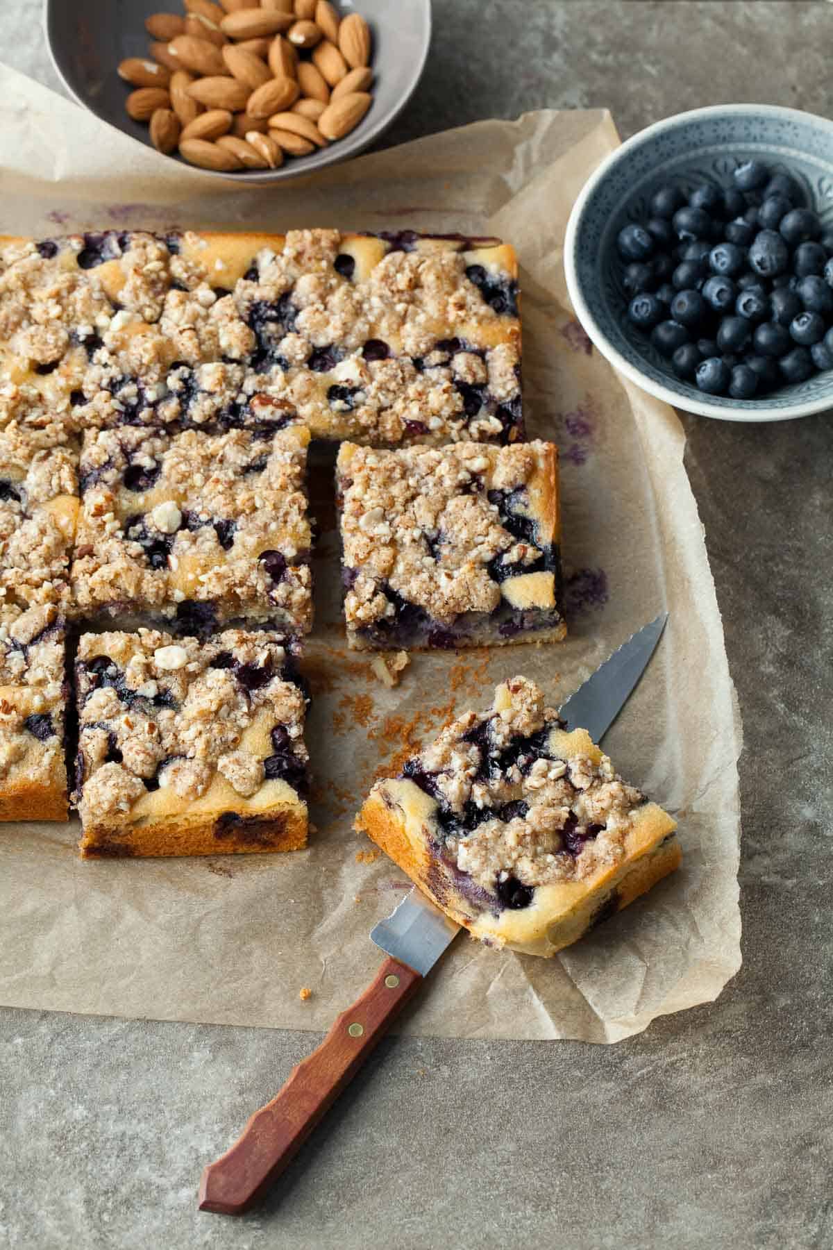 Gluten-Free Blueberry Cake on Parchment with Knife