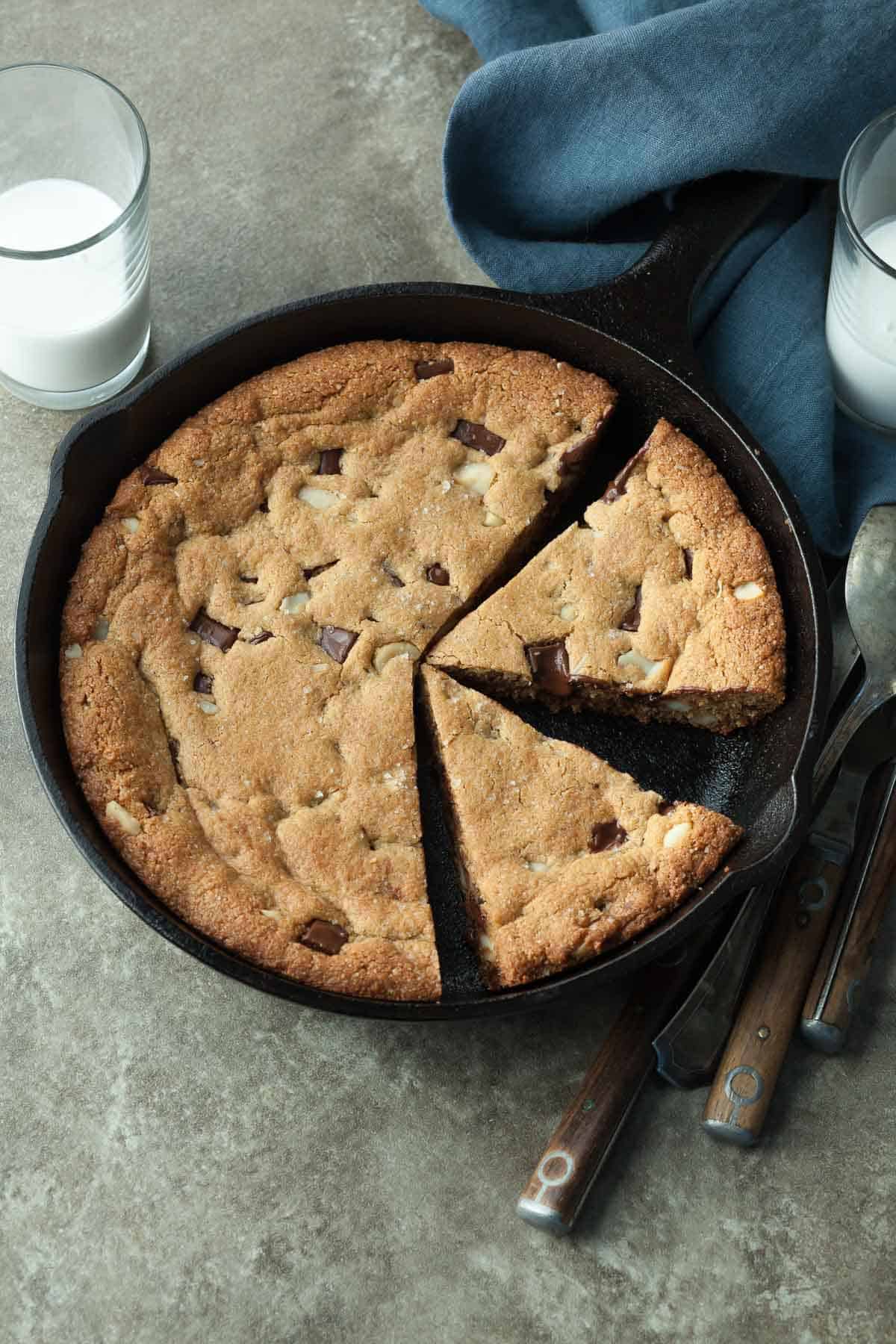 Vegan Chocolate Chip Skillet Cookie with Glasses of Milk