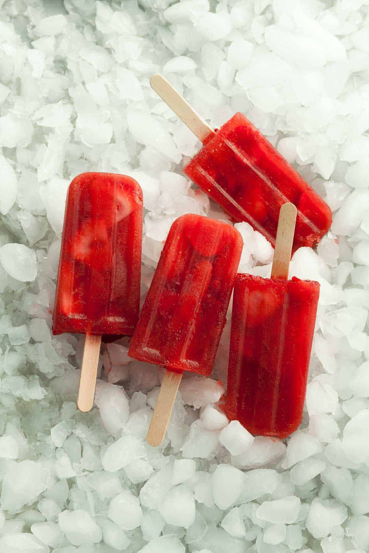 Frozen Fruit Popsicles on Bed of Ice