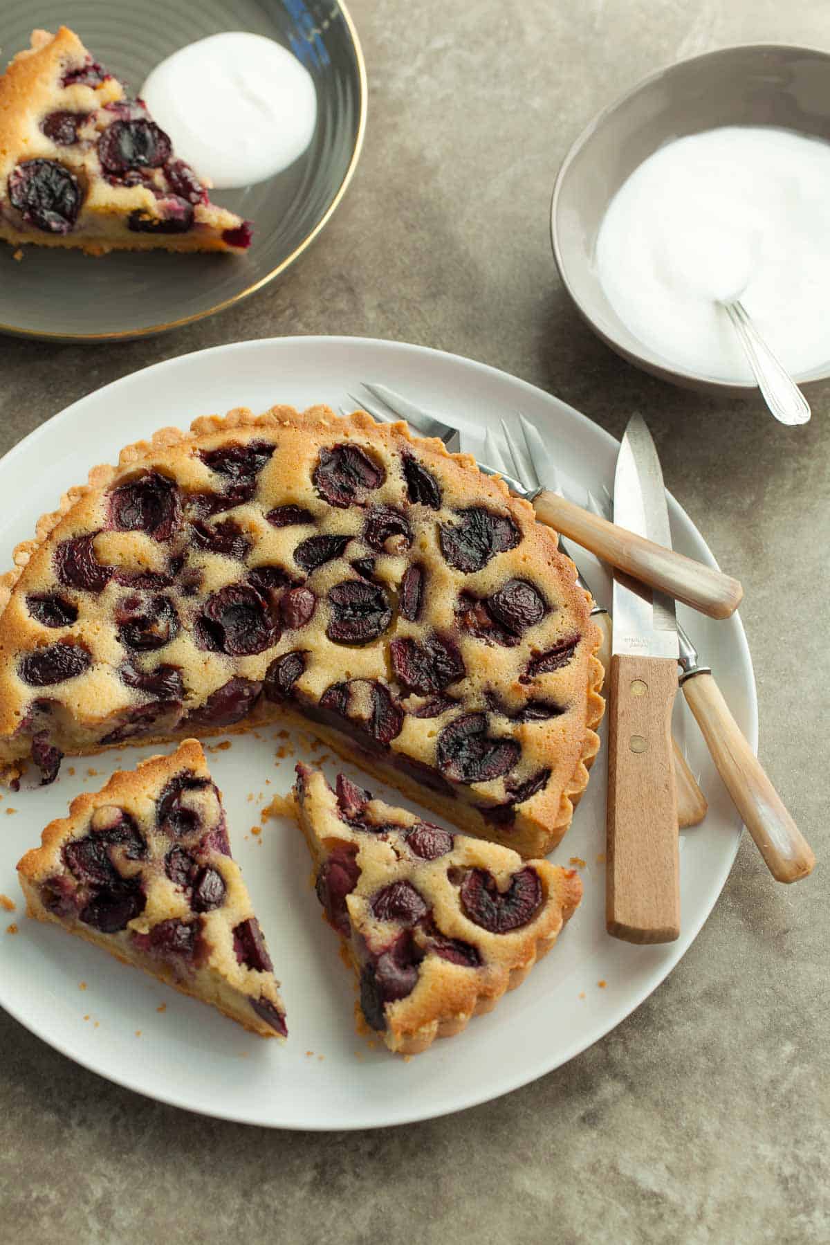 Frangipane Cherry Tart on Plate with forks and knife