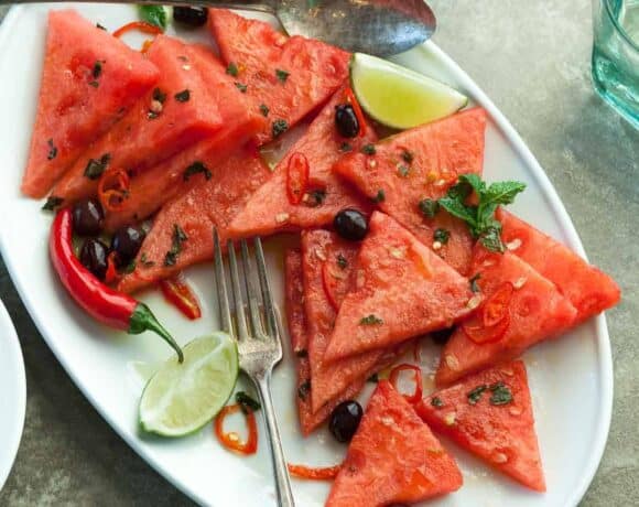 Watermelon Salad with Chili and Mint - Fresh chili peppers add welcome heat to this refreshing summer salad of watermelon, mint and olives. #recipe #salad #healthy #paleo #vegan