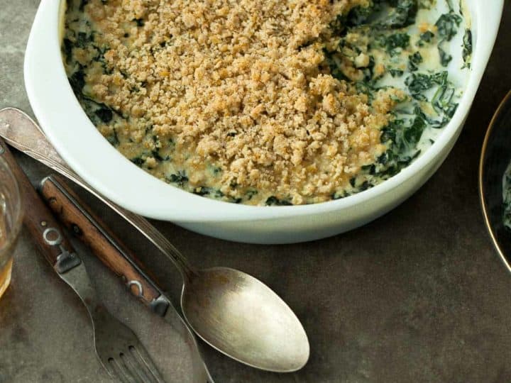 Creamed Kale Gratin (Gluten-Free) - Turn your favorite leafy green into a delicious paleo and vegan holiday gratin by baking it in the oven with a creamy sauce and adding a crispy topping. #side #recipe #kale #thanksgiving #holidays #gratin