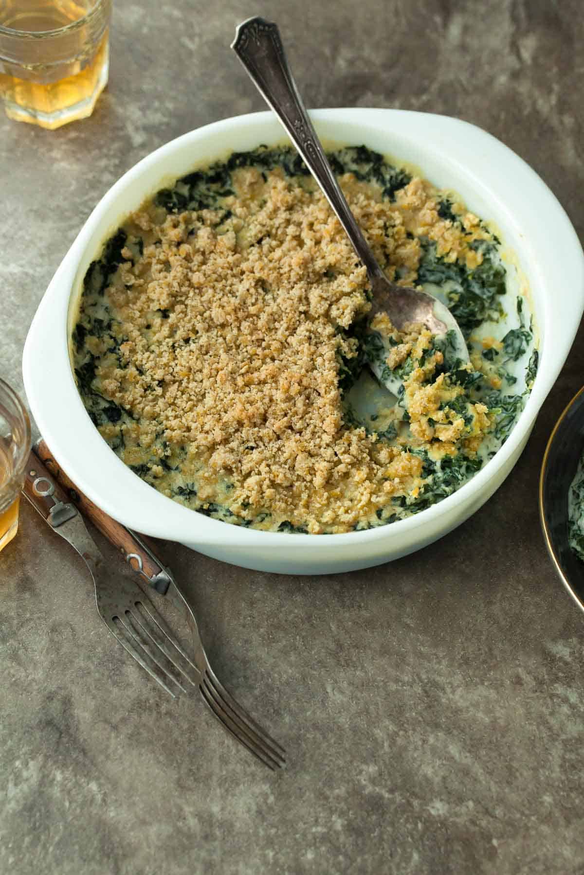 Creamed Kale in Gratin Dish with Spoon
