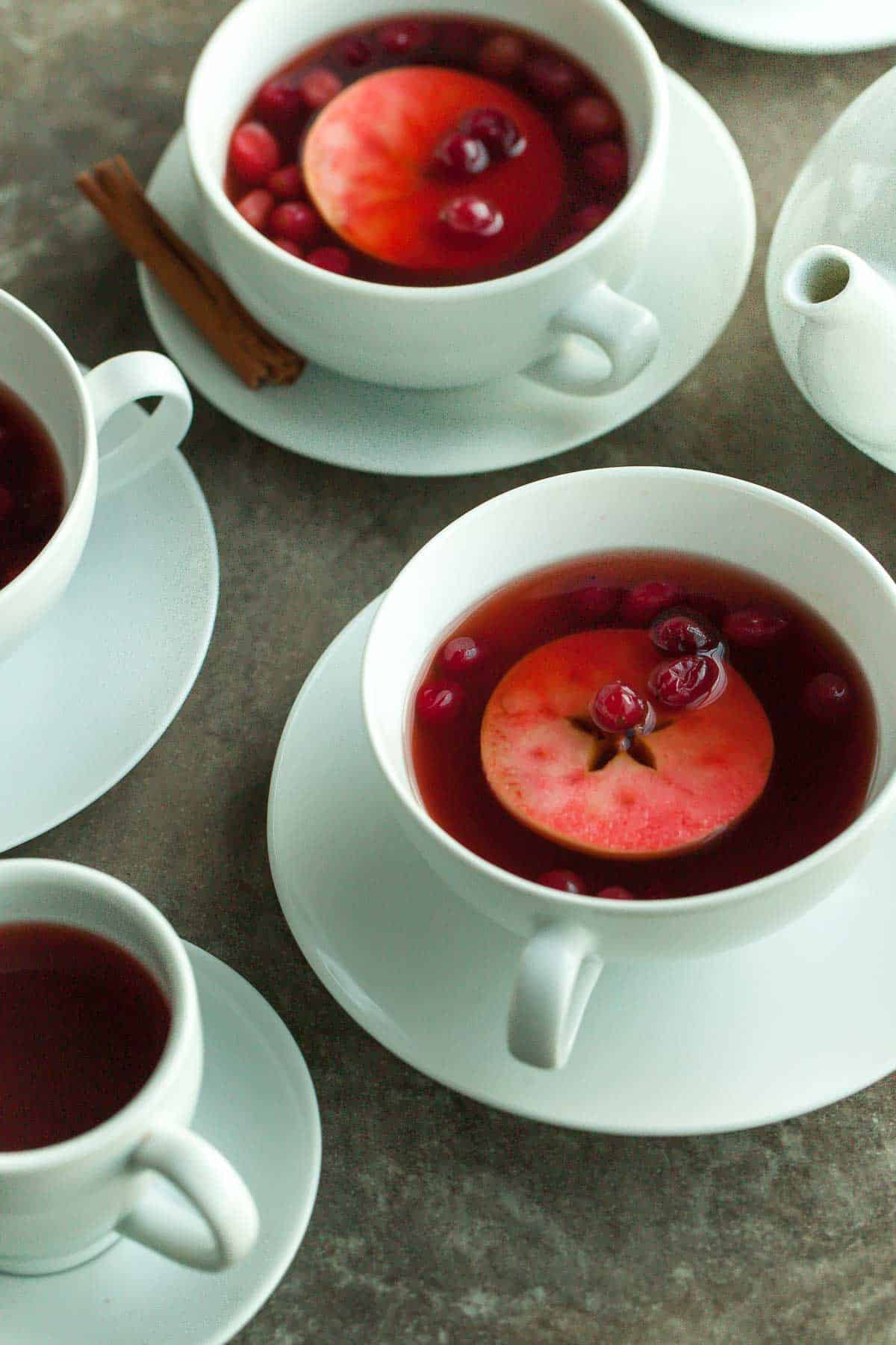 Easy Chai Spiced Mulled Cranberry Apple Cider in White Cups with Apple Slices