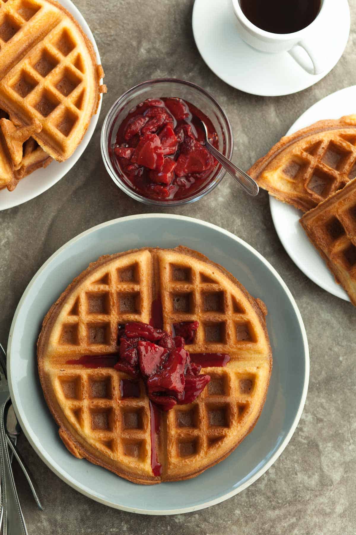 Gluten-Free Blender Waffles with Roasted Strawberry Sauce on Blue Plate