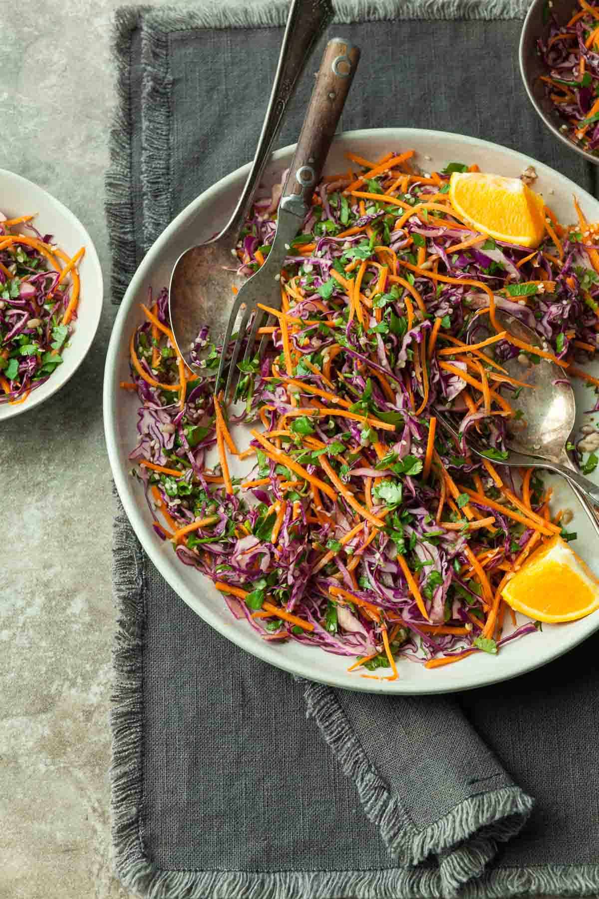 Asian Carrot Slaw with on Plate with Fork and Spoon