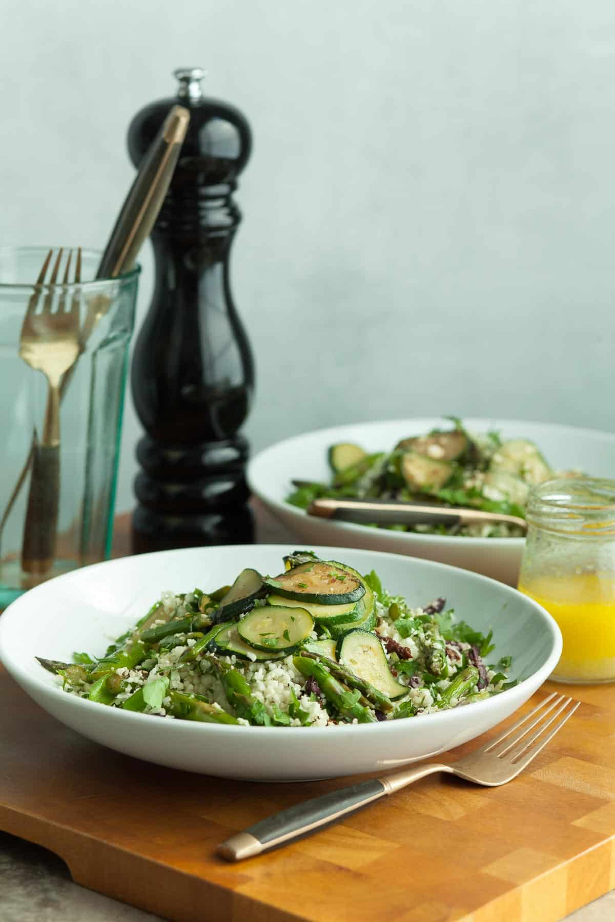 Cauliflower Rice Salad in plates on wood board