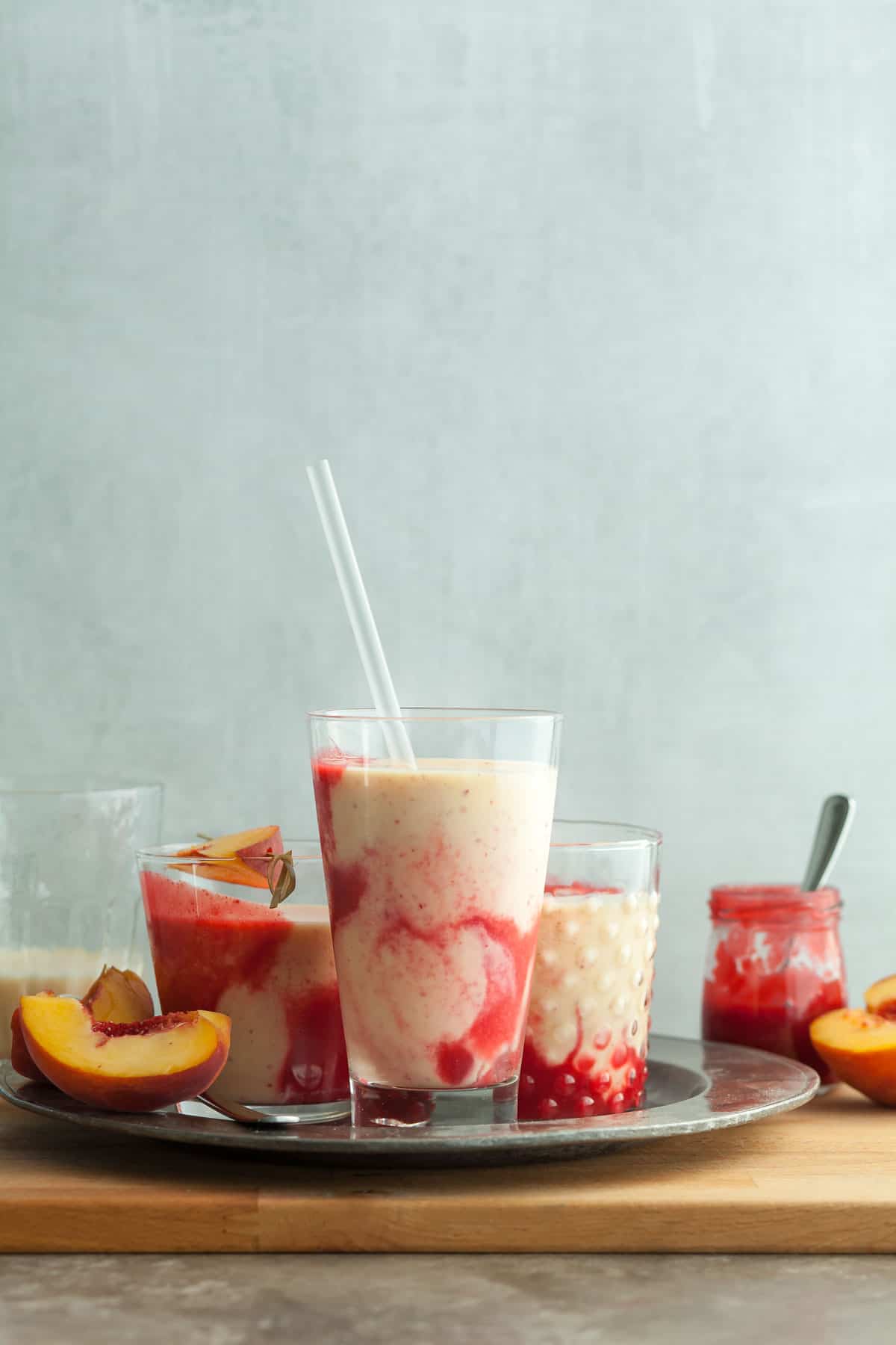 Peach Melba Lassi in Glasses with Straw on Tray