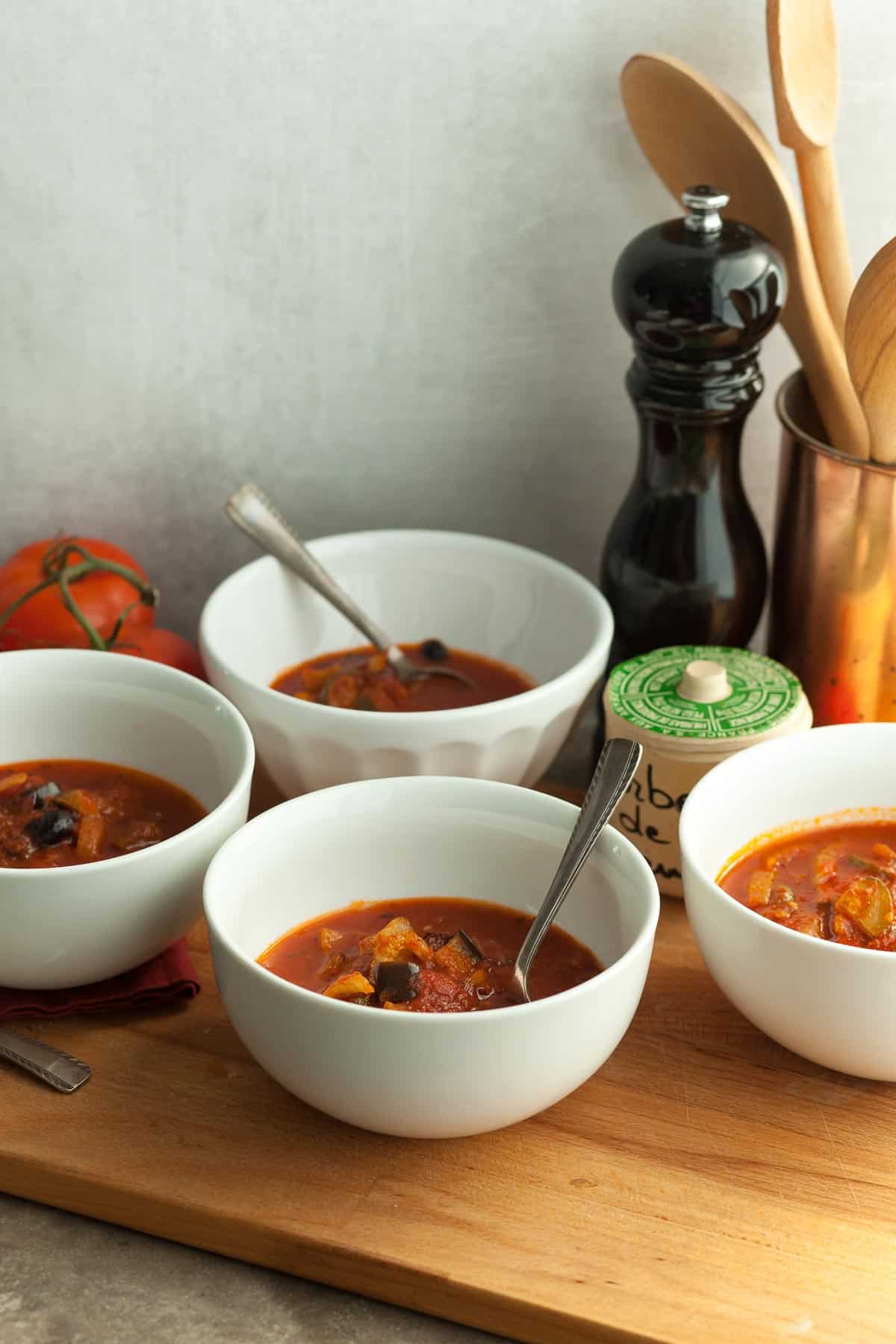 Provençal Soup in White Bowls with Spoons