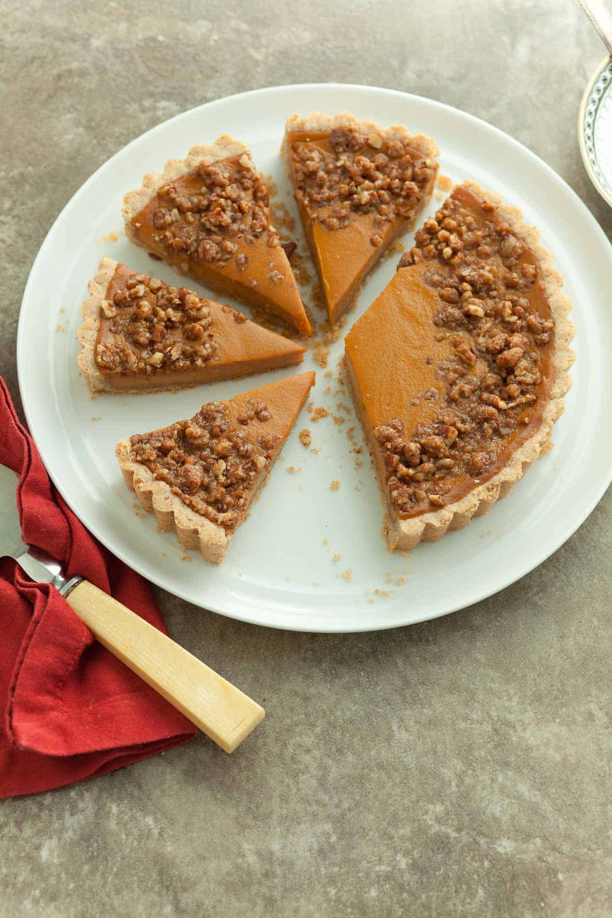 Sweet Potato Tart with Pecan Praline Topping Sliced on Serving Plate