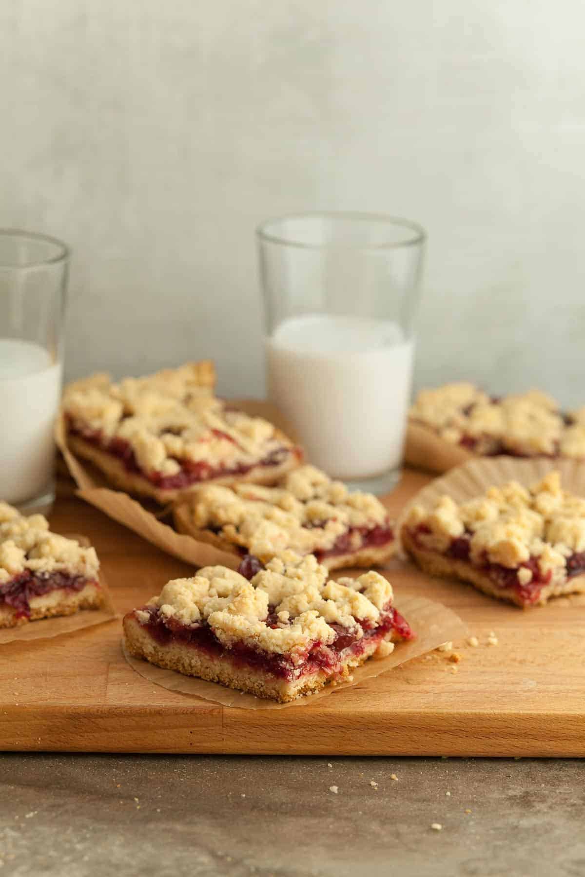 Cranberry Crumb Bars on Wood Board