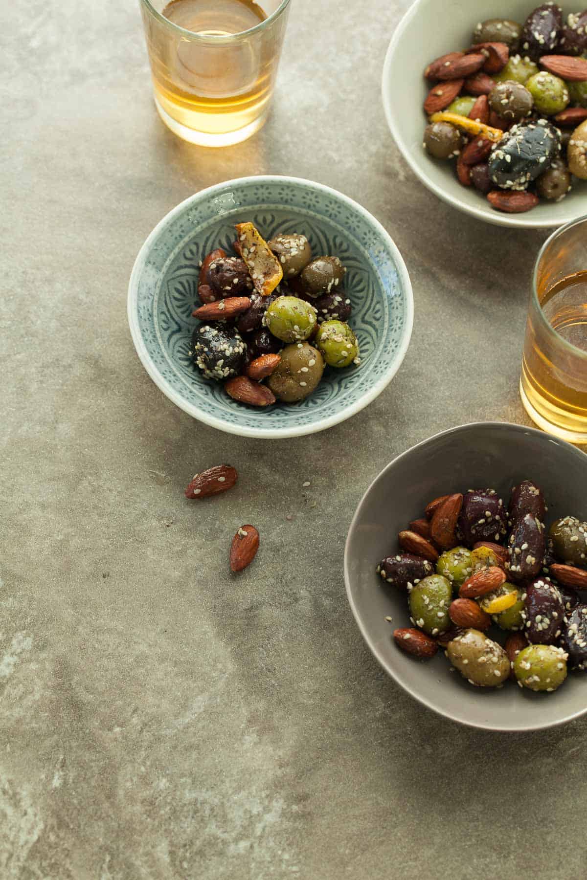 Roasted Olives and Almonds in Small Bowls