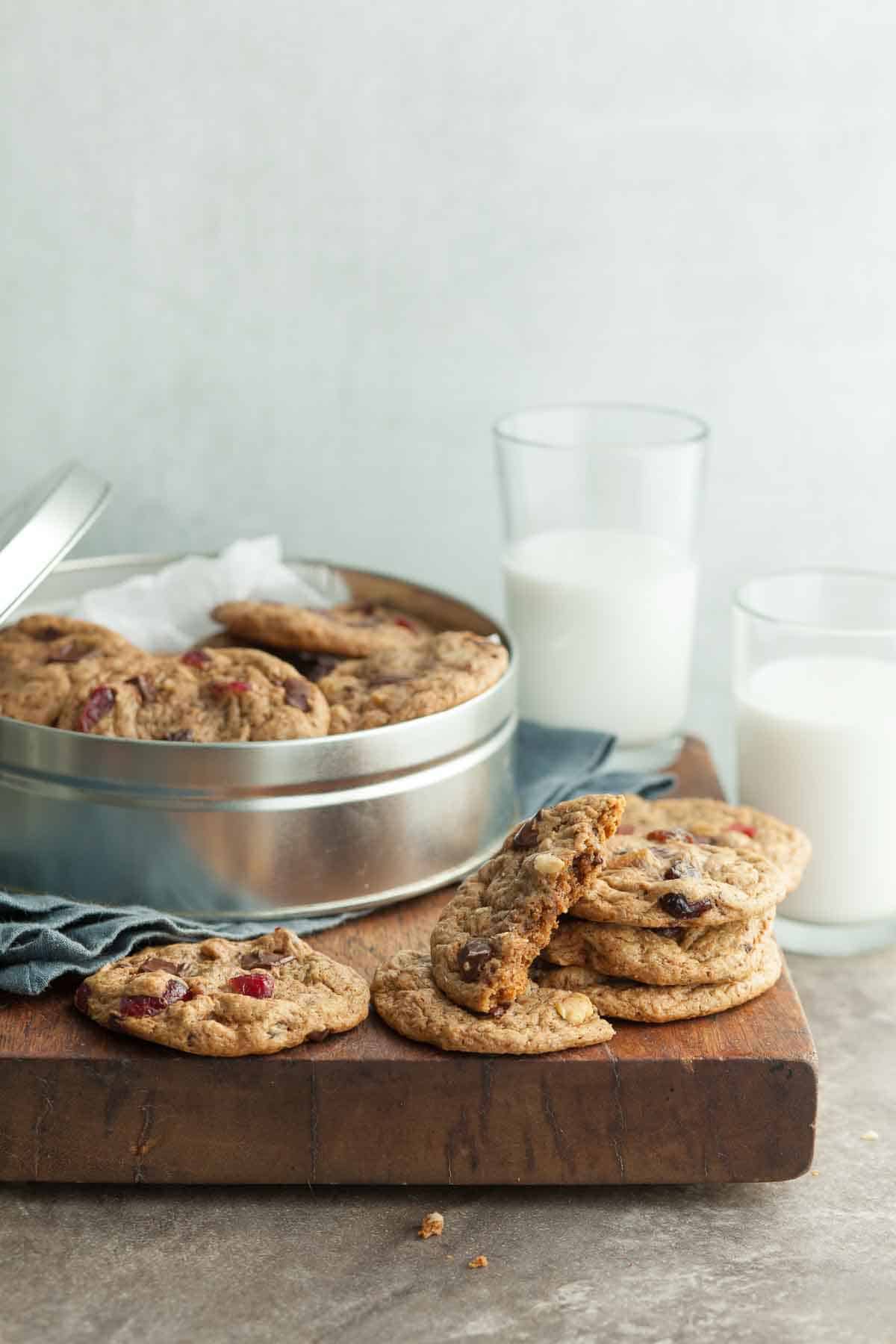 Trail Mix Cookies stacked on Wood Board