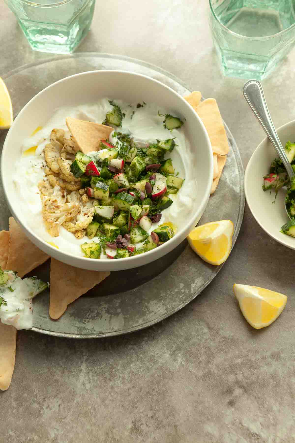 Savory Yogurt Bowl with Chips and Lemon Wedges