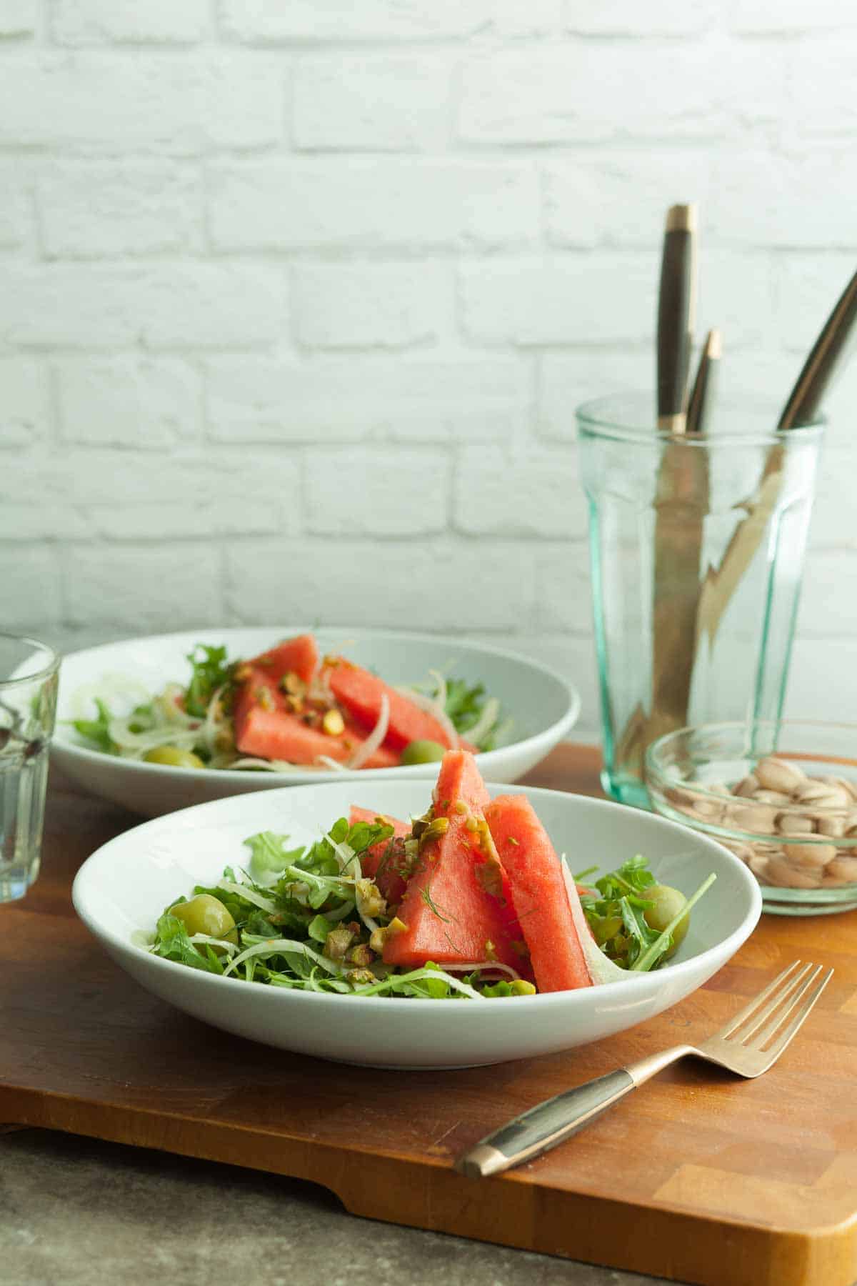 Arugula Watermelon Salad on White Plates